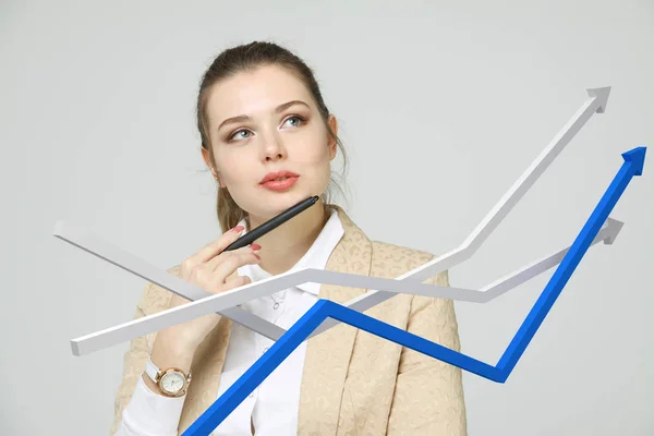 Businesswoman working with growth graph on grey background — Stock Photo, Image