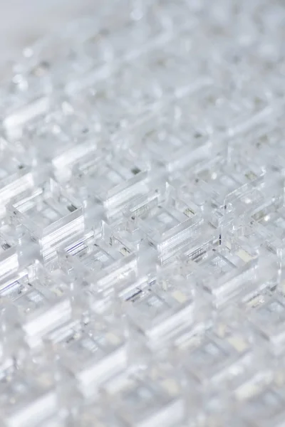 Abstrakter Hightech-Hintergrund. eine Platte aus transparentem Kunststoff oder Glas mit ausgeschnittenen Löchern. Laserschneiden von Plexiglas. — Stockfoto