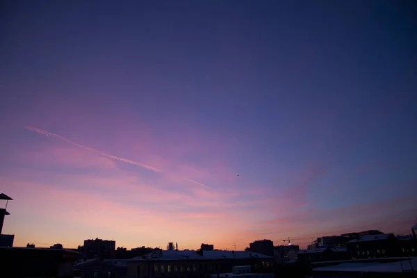 Early morning dawn twilight. Plane tracks. Moscow, Russia. December, 2011.