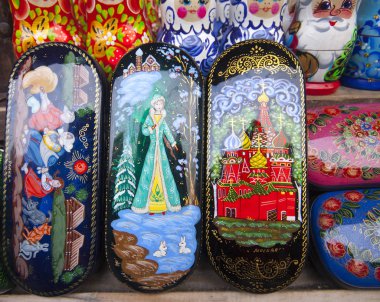Palekh caskets with miniature painting (paint papier mache boxes) at the flea market Izmailovo. Moscow, Russia. March, 2007 clipart