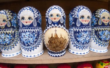 Matryoshkas with miniature painting (nested doll) at the flea market Izmailovo. Moscow, Russia. March, 2017 clipart
