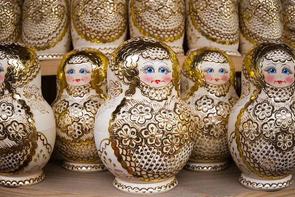 Matryoshkas with miniature painting (nested doll) at the flea market Izmailovo. Moscow, Russia. March, 2017