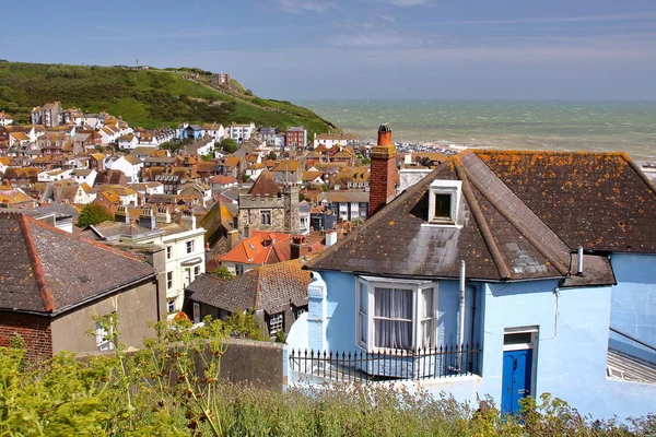 stock image HASTINGS, UK: General view of Hastings old town from West Hill with green hills and the sea in the background