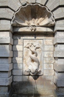 An old fountain with two fishes in Boulogne sur Mer, Cote d'Opale, Pas de Calais, Hauts de France