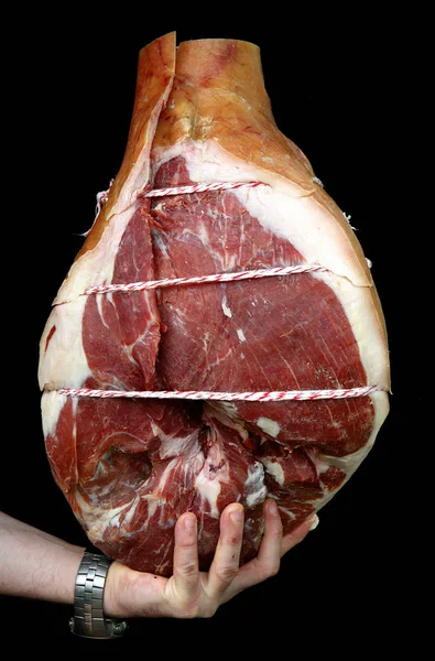 Mano sosteniendo el jamón italiano de carne de almuerzo —  Fotos de Stock