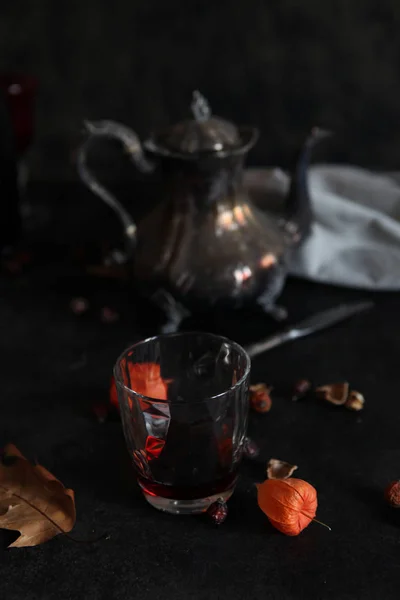 Chinese lantern flower and a silver teapot — Stock Photo, Image