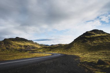 Road through rural landscape (south Iceland). clipart