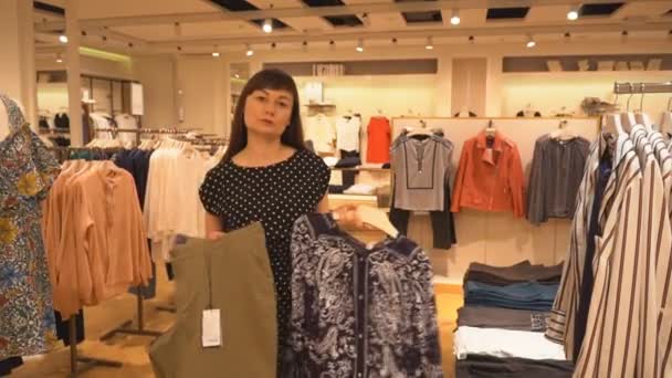 The Girl Picks up Her Pants and Blouse — Stock Video