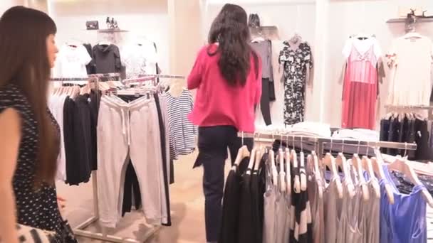 Beautiful Girls Girlfriends in Shop Choose Clothes — Stock Video