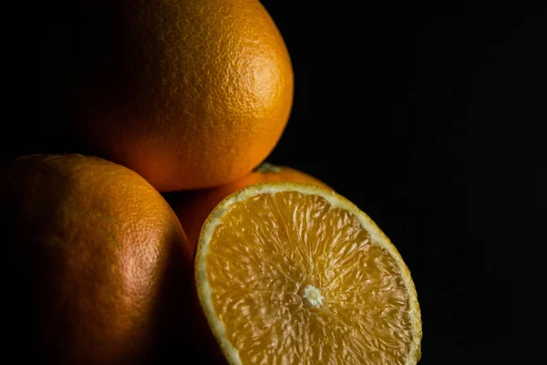 Orange in black background — Stock Photo, Image