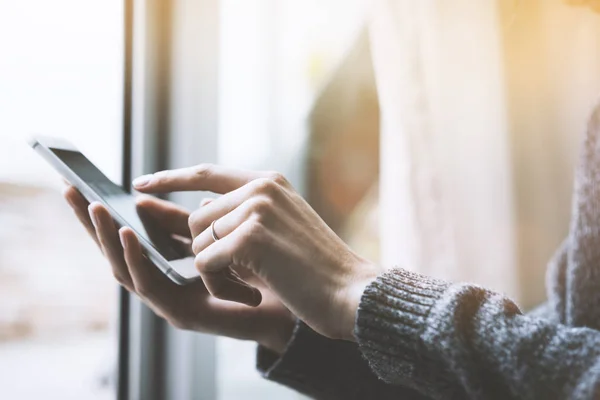 female using modern smart phone