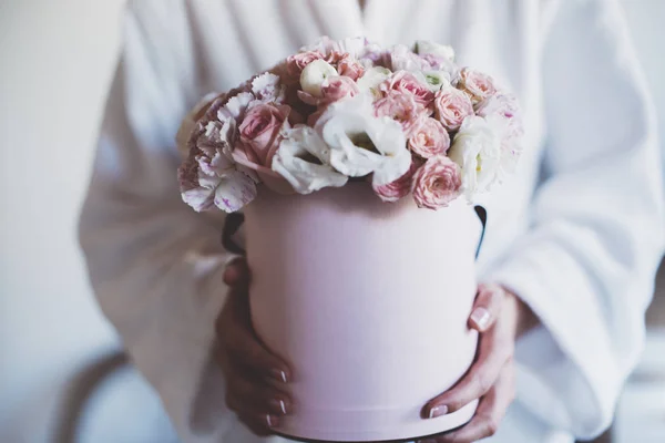 woman holding roses bouquet