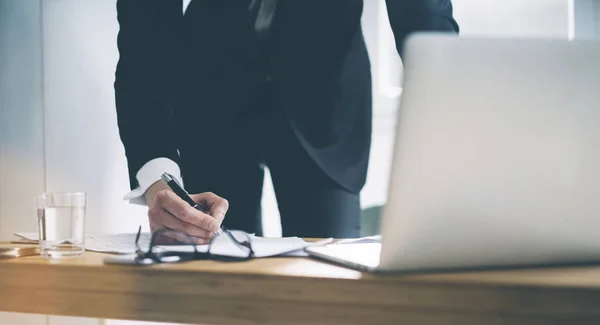 Businessman using laptop at office — Stock Photo, Image