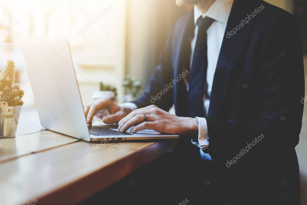 businessman using laptop in coffee shop