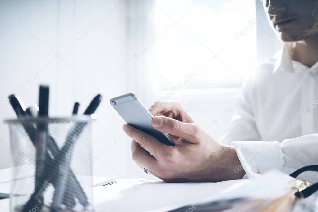 young businessman using cellphone