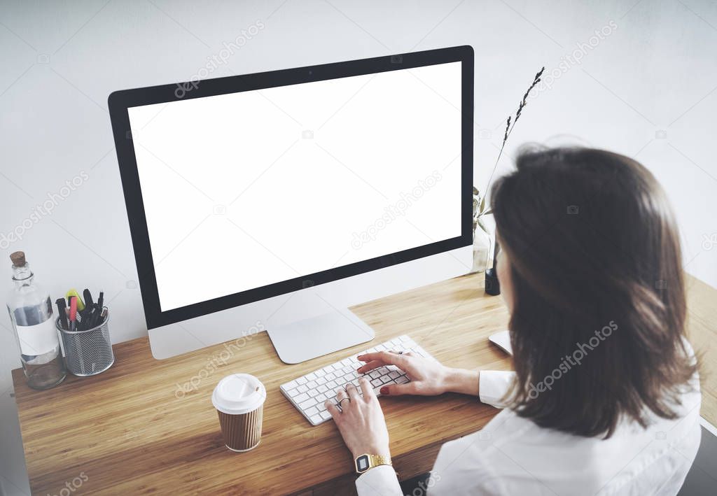 businesswoman working on computer with blank screen