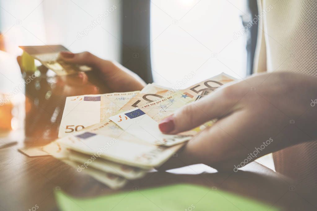 female hands counting euro bills 
