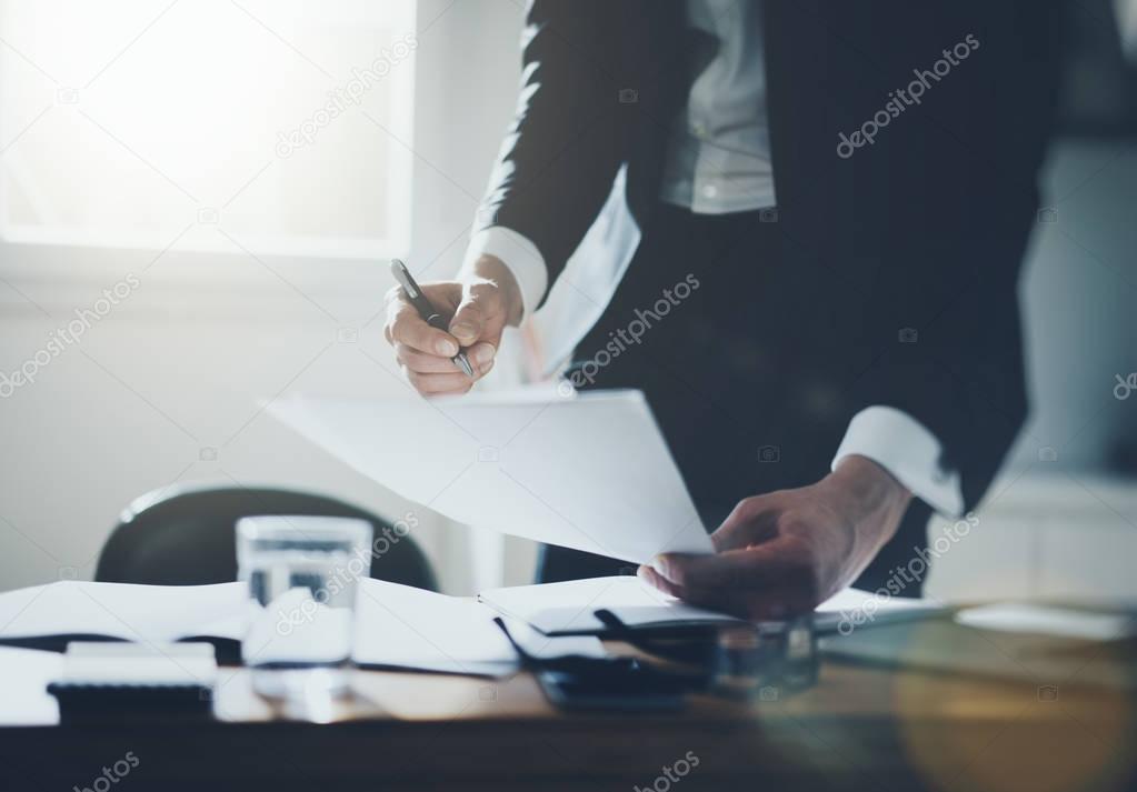 Businessman signing documents 