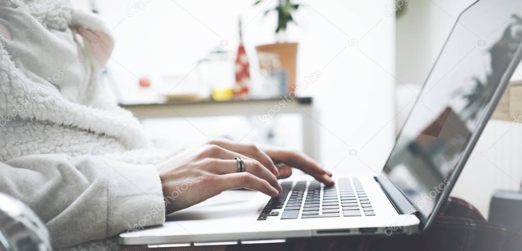 female working on laptop at home
