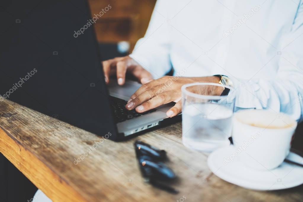male hands using laptop 