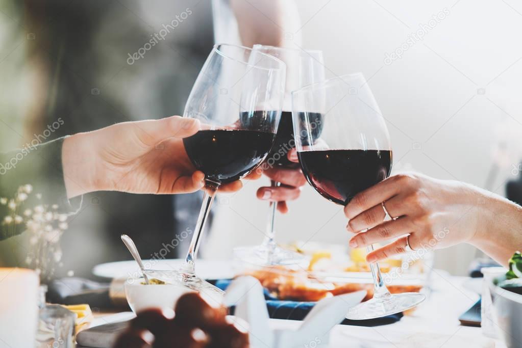 friends cheering with wine 