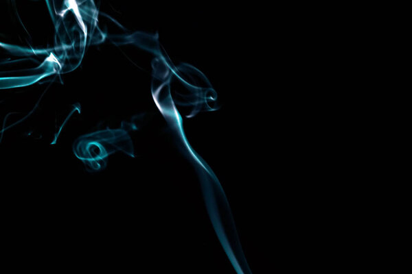 Smoke of incense isolated on black