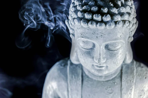 Buddha statue in the smoke of incense — Stock Photo, Image