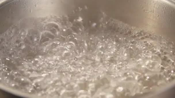 Boiling a pot of water in slow motion — Stock Video