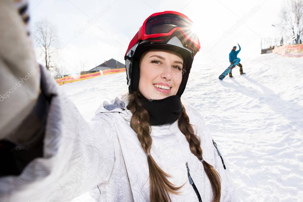 Snowboarder taking selfie