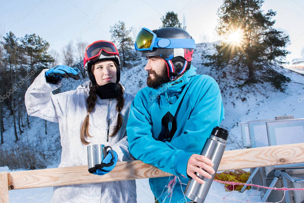 Snowboarders drinking tea 