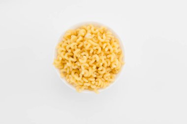 Uncooked macaroni in plate clipart