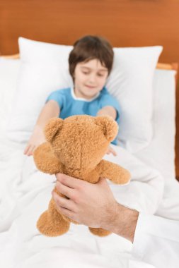 child patient with teddy bear clipart