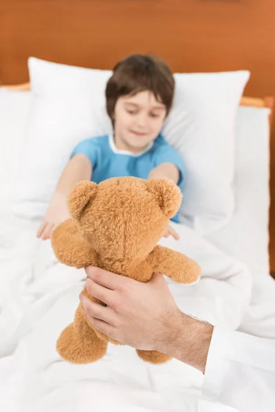 child patient with teddy bear