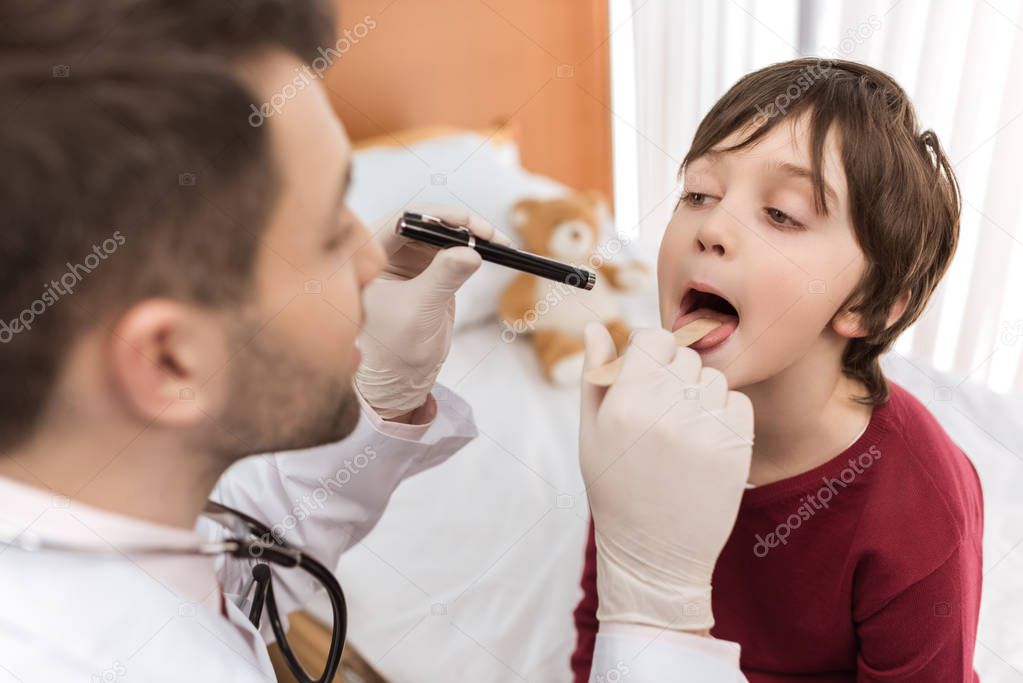 Doctor examining child patient 