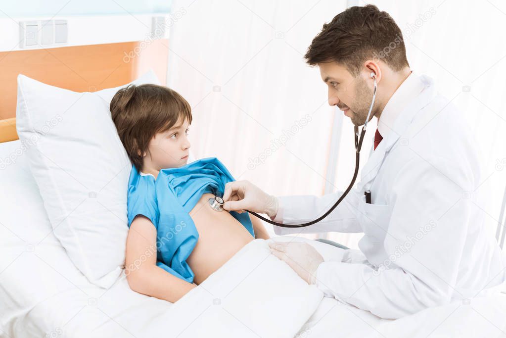 doctor examining child patient 