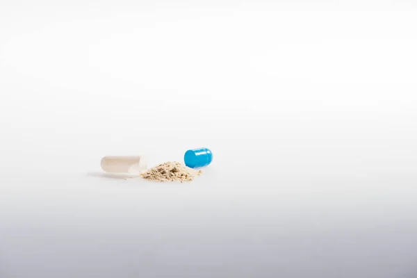 Open capsule with medication — Stock Photo, Image