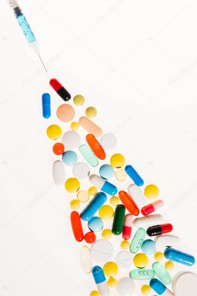 Medical pills and syringe