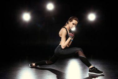 sportswoman doing stretching exercises