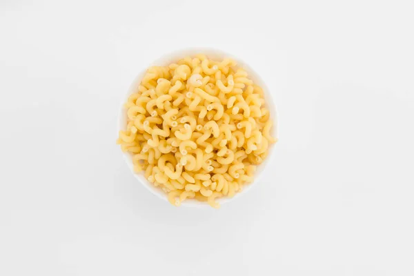 Macaronis non cuits dans une assiette — Photo de stock