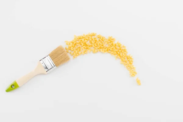 Brush leaves trail of pasta — Stock Photo