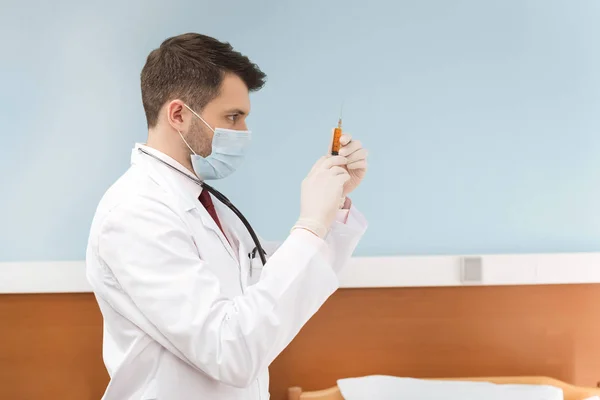 Man doctor with syringe — Stock Photo