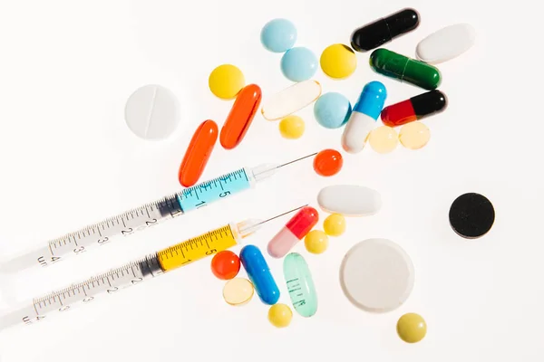 Medical pills and syringes — Stock Photo