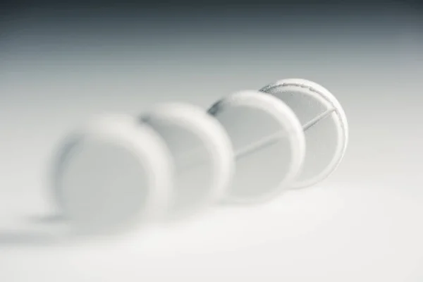 Round white tablets — Stock Photo