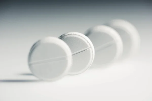 Round white tablets — Stock Photo