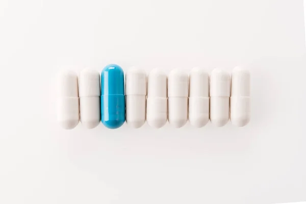 Medical capsules in row — Stock Photo