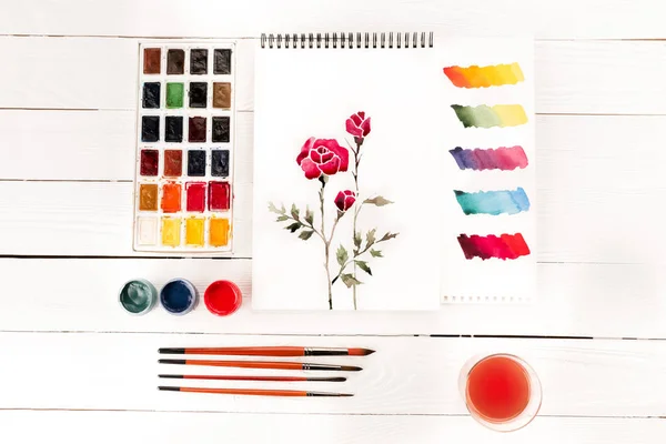 Drawing of flowers and paints — Stock Photo