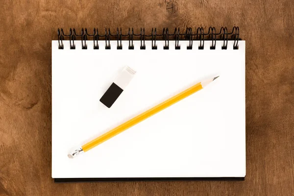 Pencil and notebook on table — Stock Photo