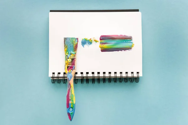 Brush and colorful brushstroke — Stock Photo