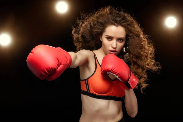 Sportswoman boxer punching — Stock Photo