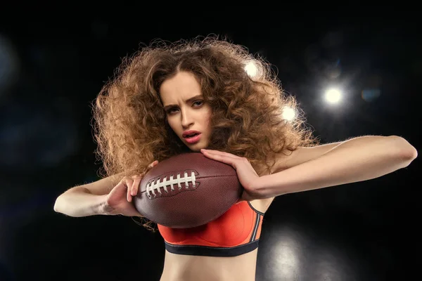 Woman holding rugby ball — Stock Photo